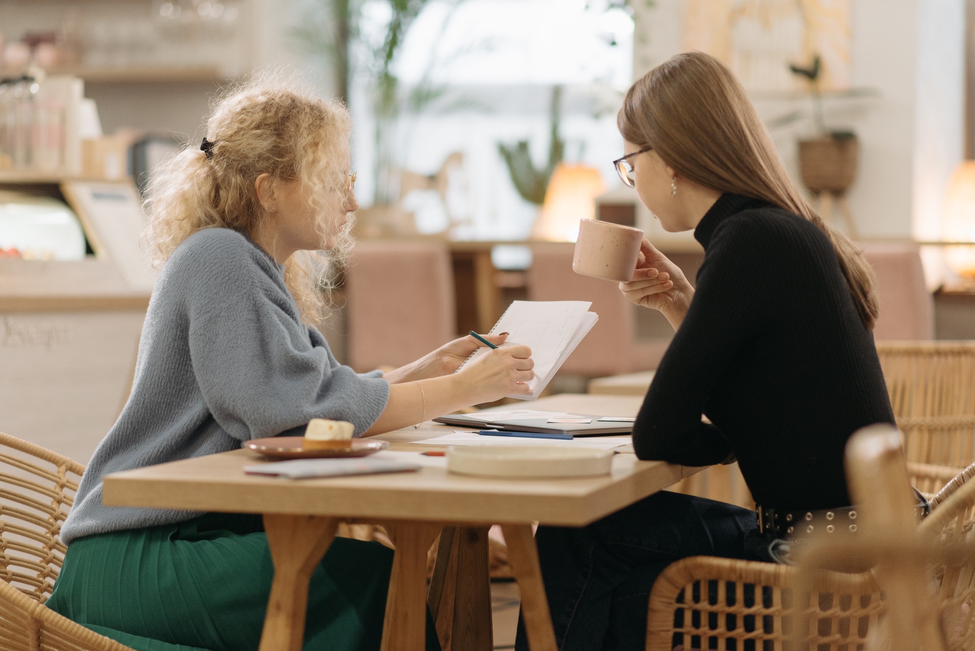Two women colleagues doing quarterly performance review