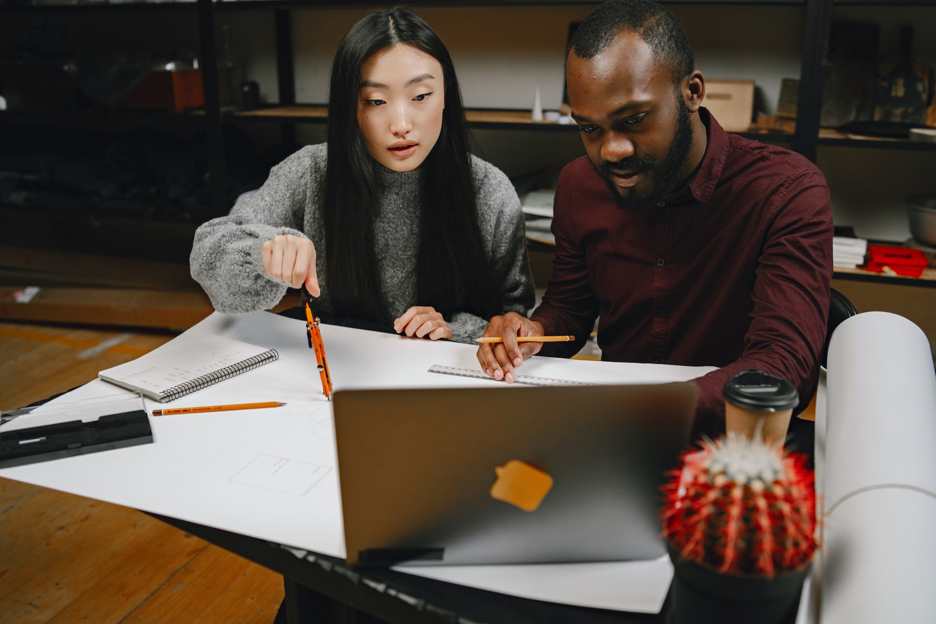 black-man-asian-woman Black man Asian woman reviewing constructive feedback examples